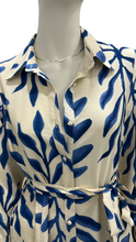 Load image into Gallery viewer, White dress with blue leaf pattern on a mannequin