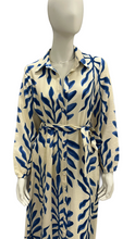 Load image into Gallery viewer, Mannequin wearing a beige dress with blue leaf pattern on a white background