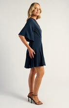 Load image into Gallery viewer, Navy Bell Sleeve Faux Wrap Dress with Layered Hem